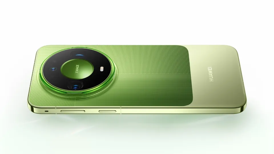 A green Huawei Mate 90 series phone lying on its back, showing the round camera module
