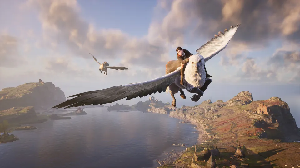 A Hogwarts student rides a hippogriff over a rocky coastline in Hogwarts Legacy