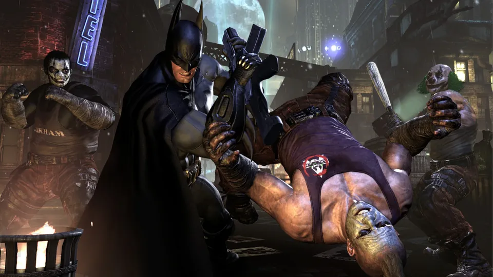 Batman fights a crowd of thugs in clown makeup on a Gotham street at night in Batman: Arkham City