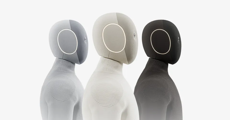 Three NEO robots side by side in gray, tan and dark brown