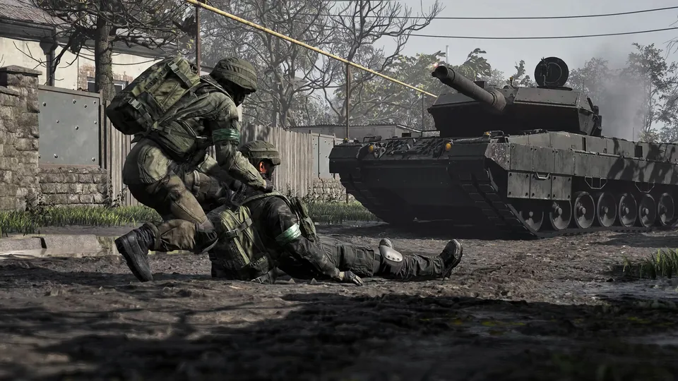 A Wardogs medic revives a fallen soldier next to a battle tank