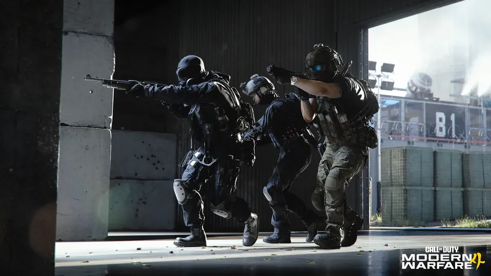 A squad in dark tactical gear pushes through a concrete doorway with rifles aimed