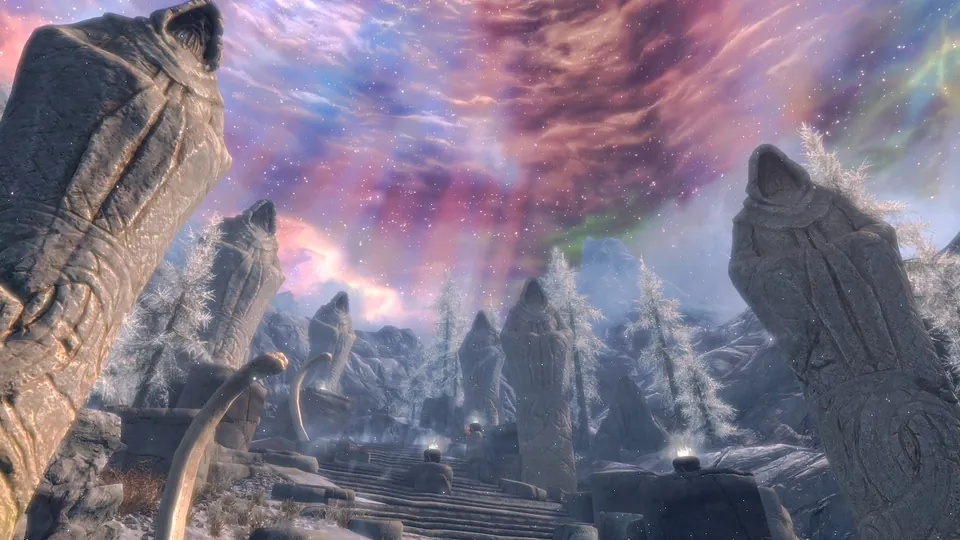 Giant carved stone statues line a snowy path under a swirling, colorful sky in Skyrim Anniversary Edition on Nintendo Switch 2