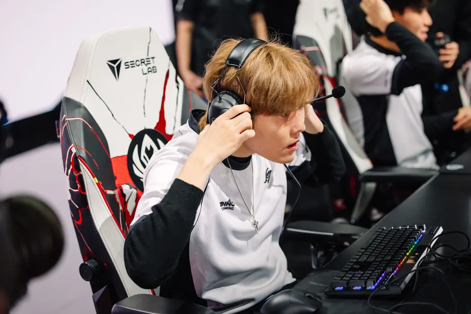 A Team Secret Whales player puts on a headset at the desk on day 5 of the MSI 2026 bracket stage in Daejeon