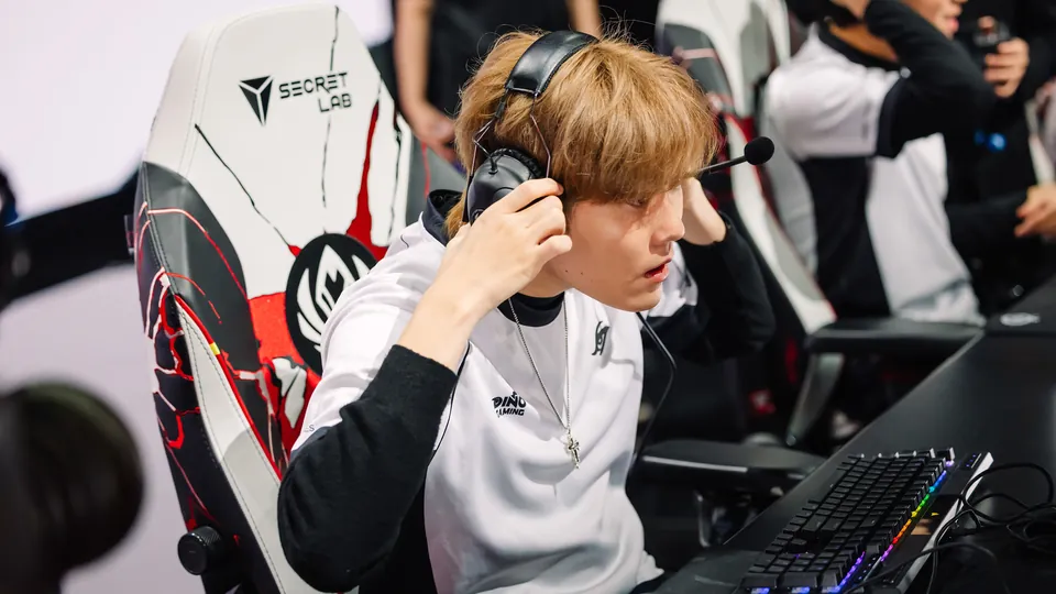 A Team Secret Whales player puts on a headset at the desk on day 5 of the MSI 2026 bracket stage in Daejeon