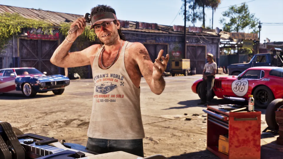 A mechanic in a sleeveless shirt waving in a dusty garage yard lined with classic muscle cars in Grand Theft Auto VI