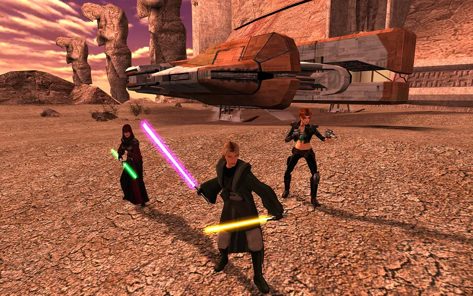 Three characters with lightsabers stand by a ship in the desert in Knights of the Old Republic II