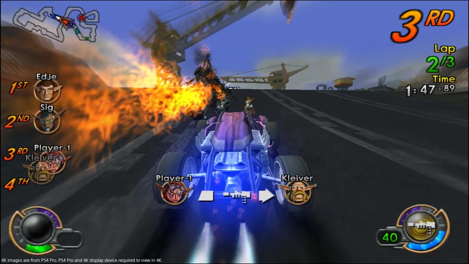 A combat car boosts down a race track as a rocket explodes ahead in Jak X: Combat Racing