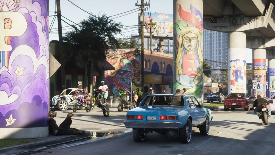 Traffic passes under a mural-covered overpass in Vice City, GTA 6