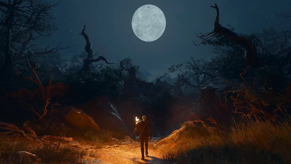 Geralt holds a torch on a dark path under a full moon and dead trees in The Witcher 3: Songs of the Past