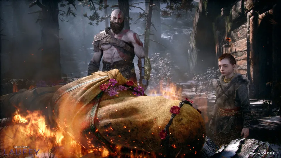 Kratos and young Atreus beside Faye's burning funeral pyre