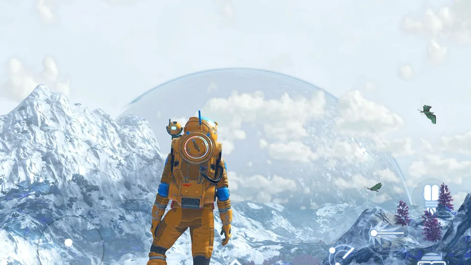 An explorer in an orange suit stands on a snowy mountain below a huge pale planet in No Man's Sky on iPad