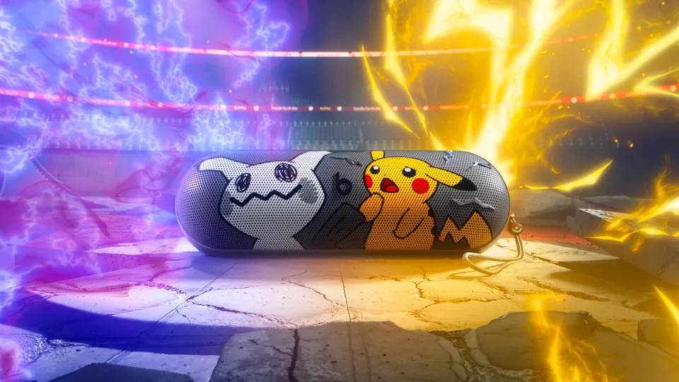 Special-edition Pokémon Beats Pill with Pikachu and Mimikyu on the grill, in a stadium lit by purple and yellow lightning