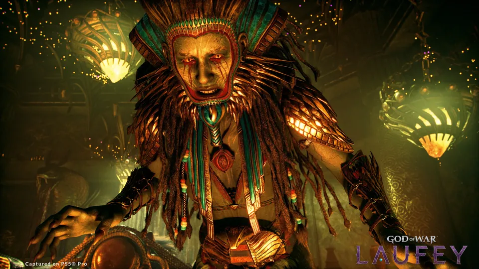 A masked god with a feathered headdress lit by golden lamps