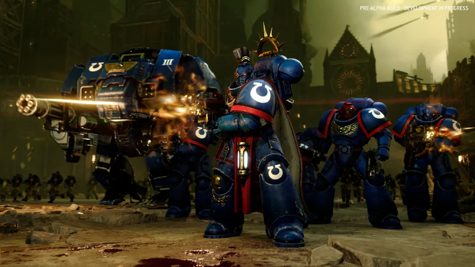 Blue-armored Space Marines and a firing Dreadnought in a battle in Total War: Warhammer 40,000