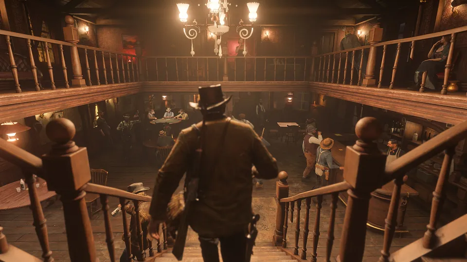 Arthur Morgan walks down a staircase into a crowded saloon lit by chandeliers in Red Dead Redemption 2