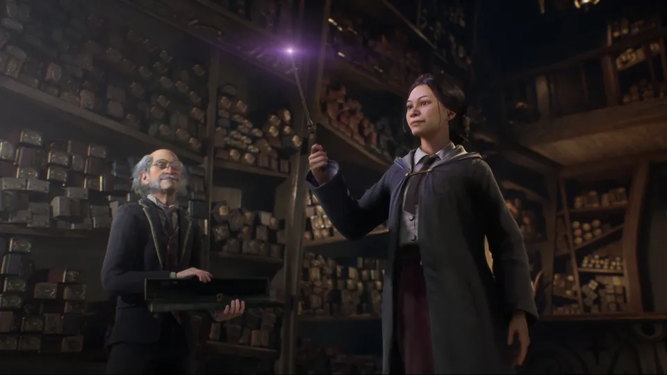 A student raises a glowing wand in a wand shop as the old wandmaker watches