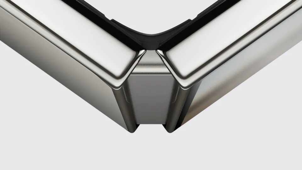 A close-up of the iPhone Duo's titanium hinge, half folded, with its micro-blasted hinge cover