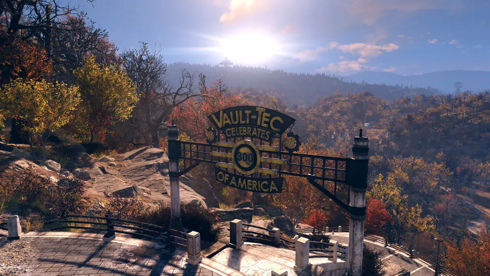 A Vault-Tec sign arches over a road through autumn forest in the hills of Appalachia in Fallout 76