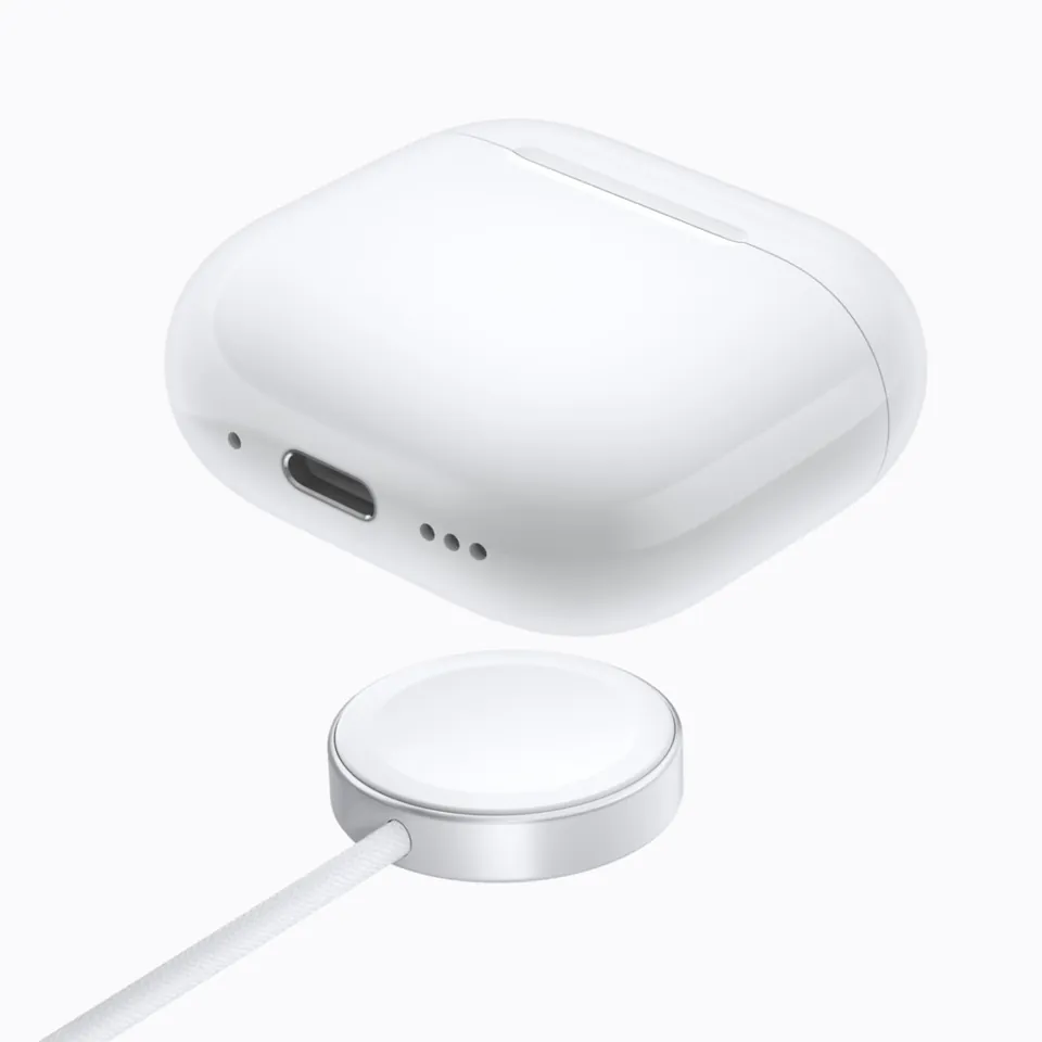 The AirPods 5 Wireless Charging Case next to a round charger