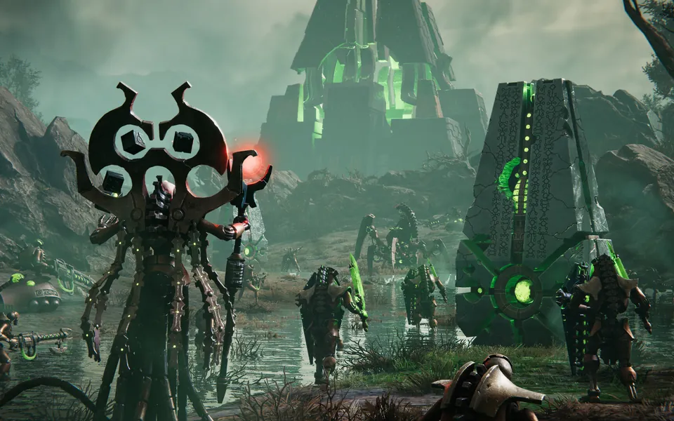 A Necron lord with a tall ornate staff walks through a swamp past glowing green Necron pylons and warriors in Dawn of War IV