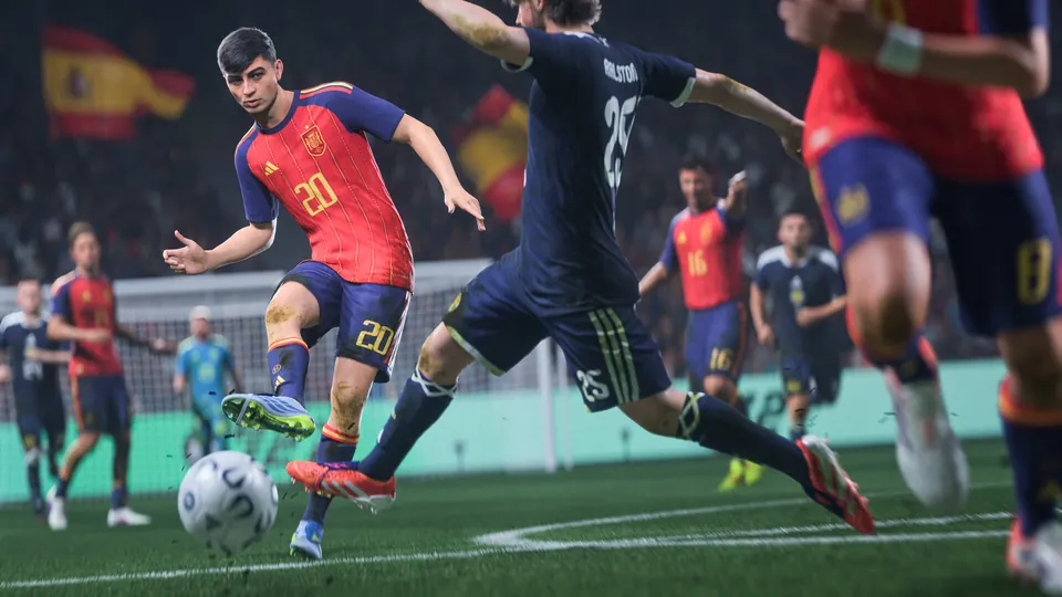 A Spain player in a No. 20 shirt strikes the ball past a defender in EA Sports FC 27