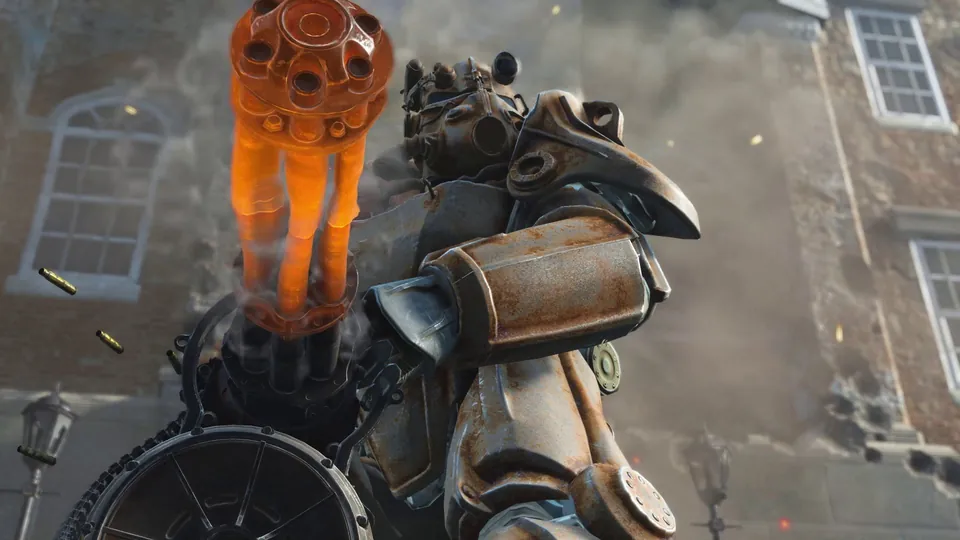 A soldier in rusty power armor fires a minigun on a ruined Boston street