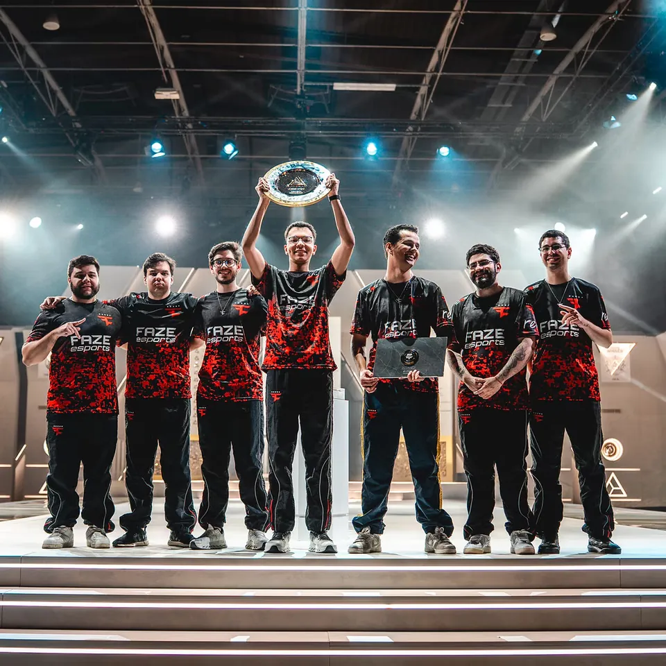 FaZe Clan players lift the Esports World Cup 2026 Rainbow Six Siege trophy on stage