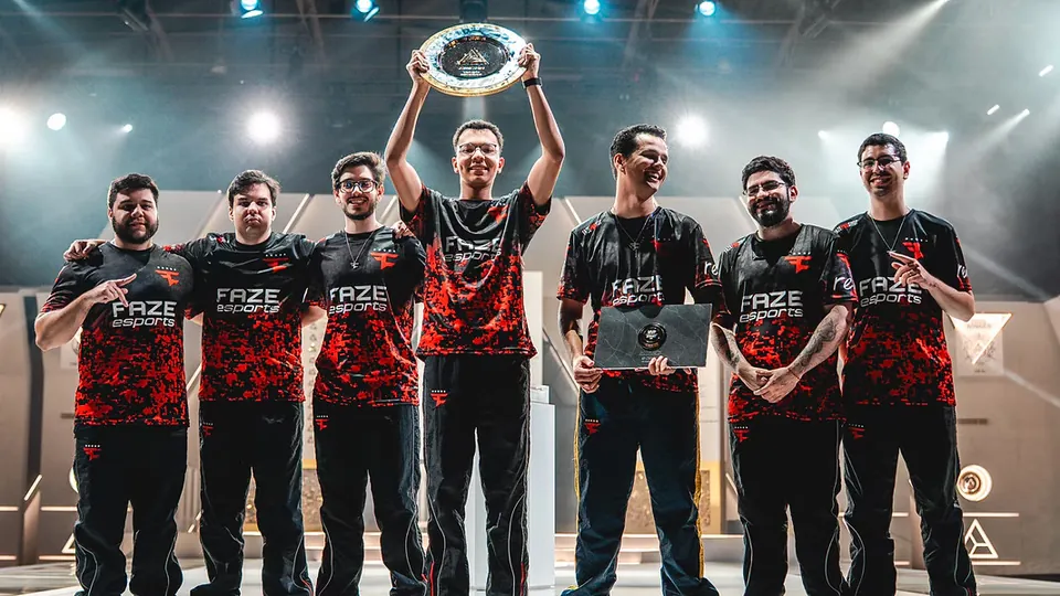 FaZe Clan players lift the Esports World Cup 2026 Rainbow Six Siege trophy on stage