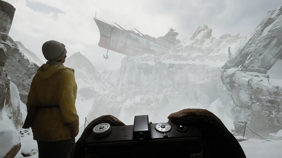 A traveler in a yellow coat stands on a snowy mountain ridge as a zeppelin floats above the peaks