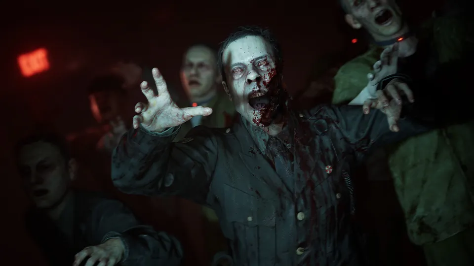 Zombies reach out in a red-lit corridor in Resident Evil Veronica