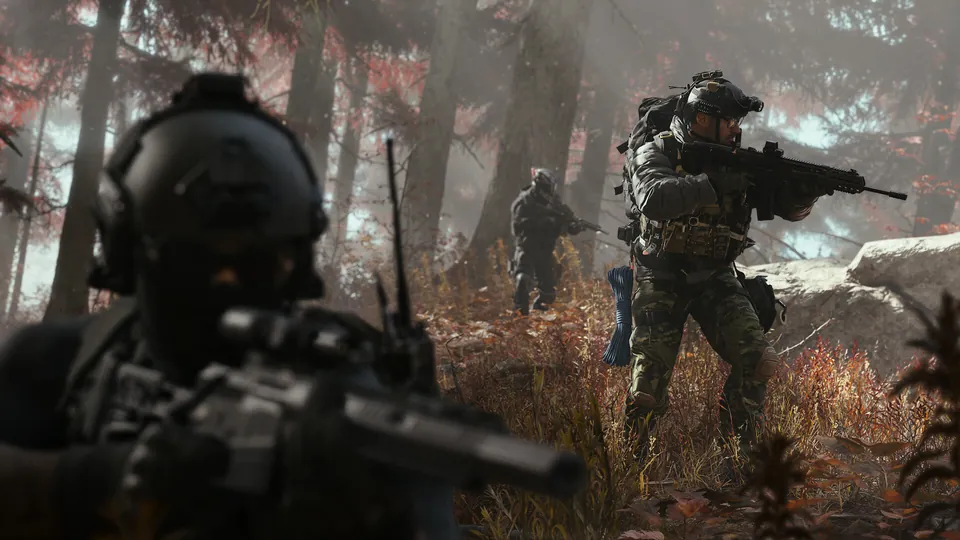 Soldiers with rifles move through a red autumn forest in Modern Warfare 4