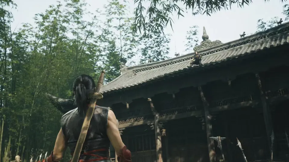 A fighter with a wooden sword on the back walks toward an old temple in a bamboo forest in Phantom Blade Zero.