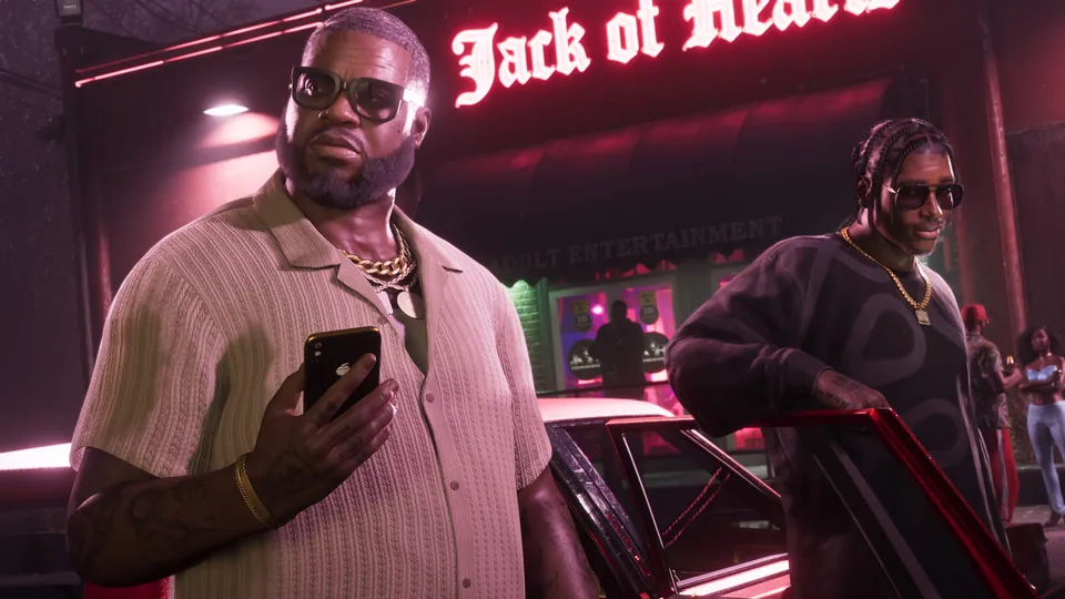 Boobie Ike holds a phone outside the Jack of Hearts club at night in Grand Theft Auto VI