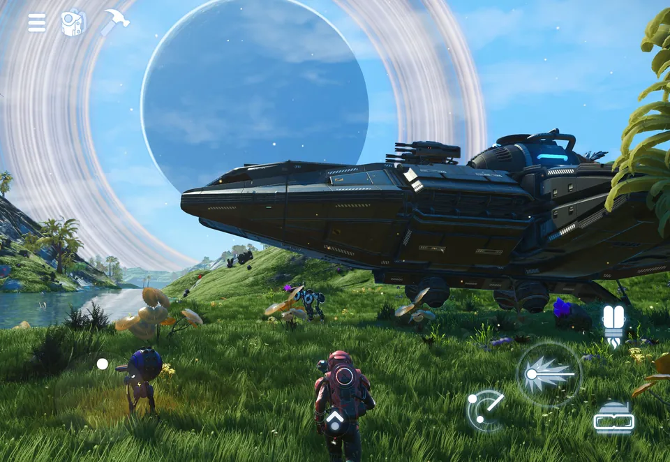 A large starship parked on a green alien meadow under a ringed planet, with touch controls on screen, in No Man's Sky on iPad