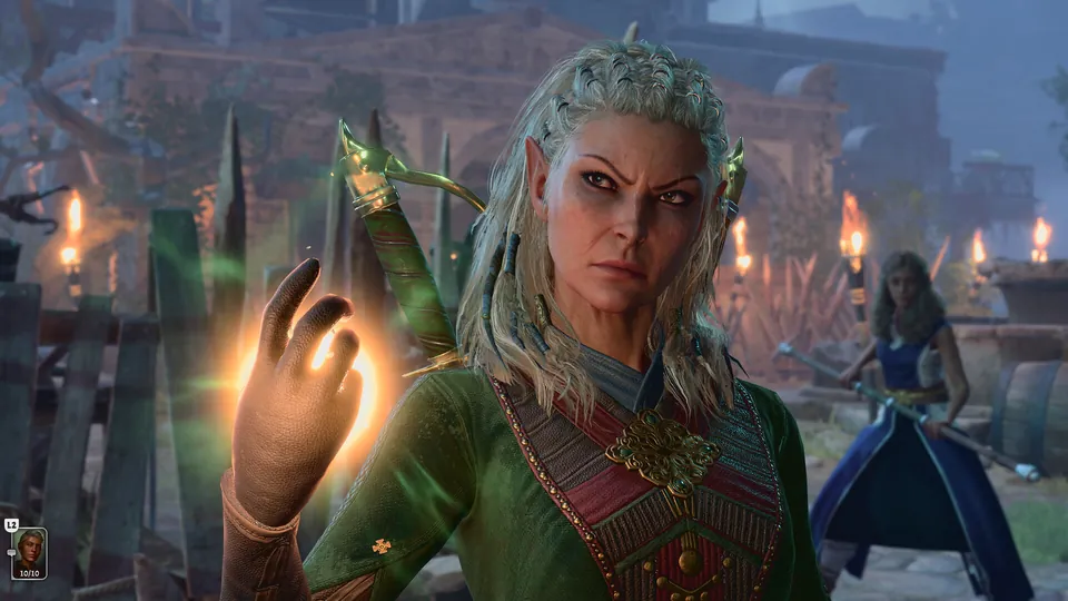 An elf druid in green armor raises a glowing hand in a torchlit camp