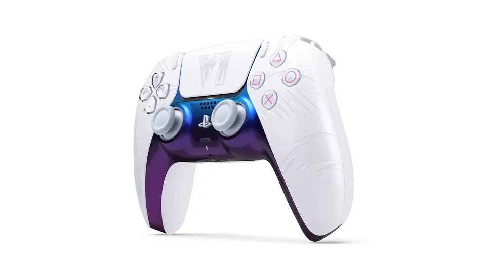 The white GTA VI DualSense controller at an angle, with palm leaf details on the grips and a purple lower edge