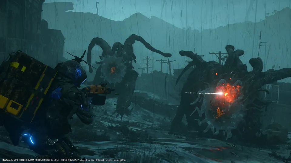A porter in a blue-lit helmet fires at two huge tentacled creatures in the rain in Death Stranding 2: On the Beach