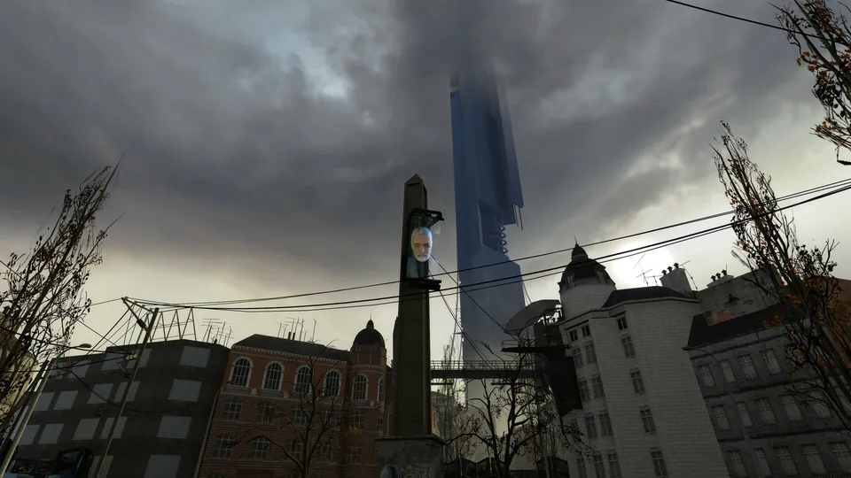 The Citadel rising behind old buildings and a monument with a Breen screen in City 17 in Half-Life 2