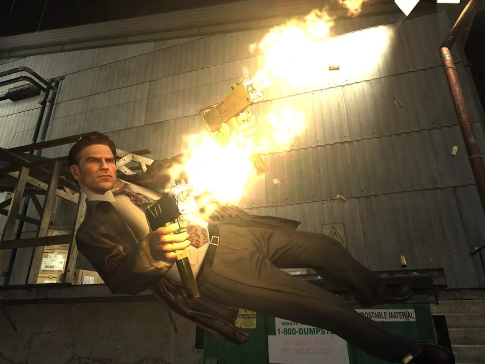 Max Payne dives sideways firing a pistol in Max Payne 2: The Fall of Max Payne
