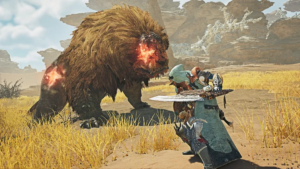 A hunter with a great sword squares up to a shaggy brown monster with glowing red wounds in Monster Hunter Wilds