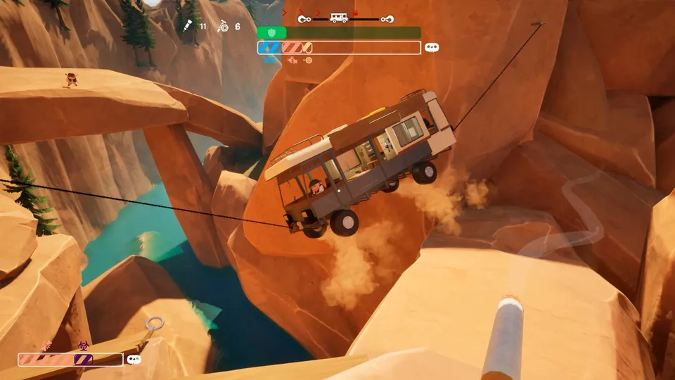 A white RV hangs from winch cables above a canyon river as it swings between red rock cliffs in RV There Yet?