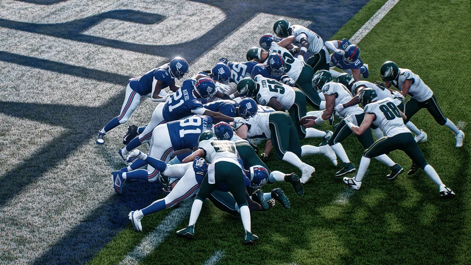 Giants and Eagles players pile up at the goal line on a short-yardage play in Madden NFL 27