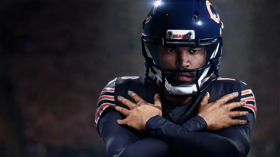 Caleb Williams in a Chicago Bears helmet and jersey crosses his arms in Madden NFL 27