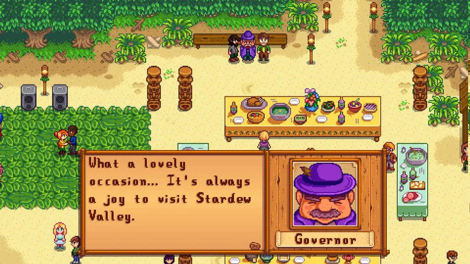 Villagers gather around a long table of food at a beach festival as the Governor praises the valley in Stardew Valley