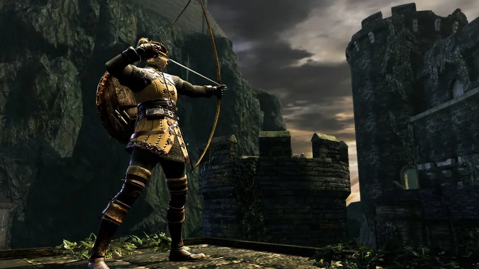 A player in golden armor draws a bow on a castle wall in Dark Souls Remastered