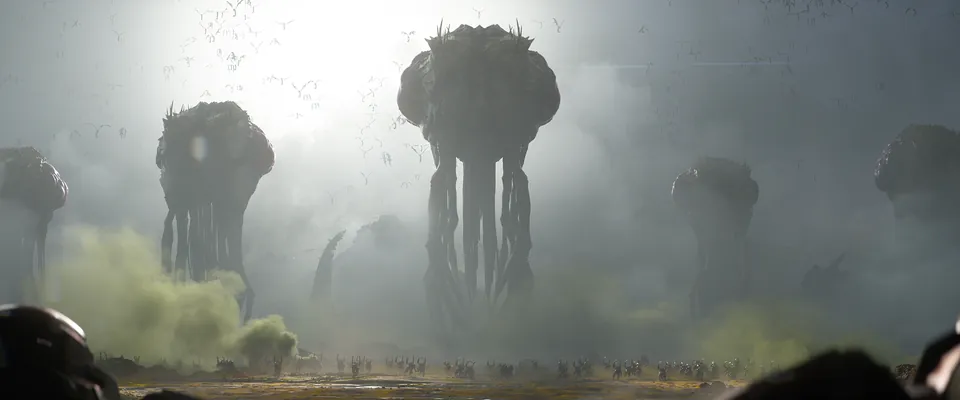 Giant alien spires rise out of green fog over a crowded plain in the new StarCraft