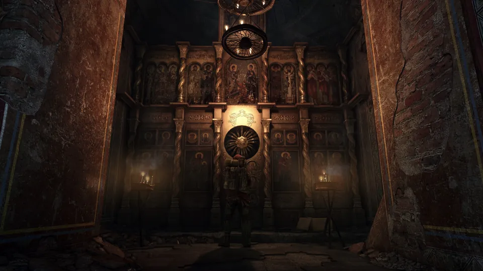 A soldier stands before a candlelit wall of painted icons inside an abandoned church in Metro Redux