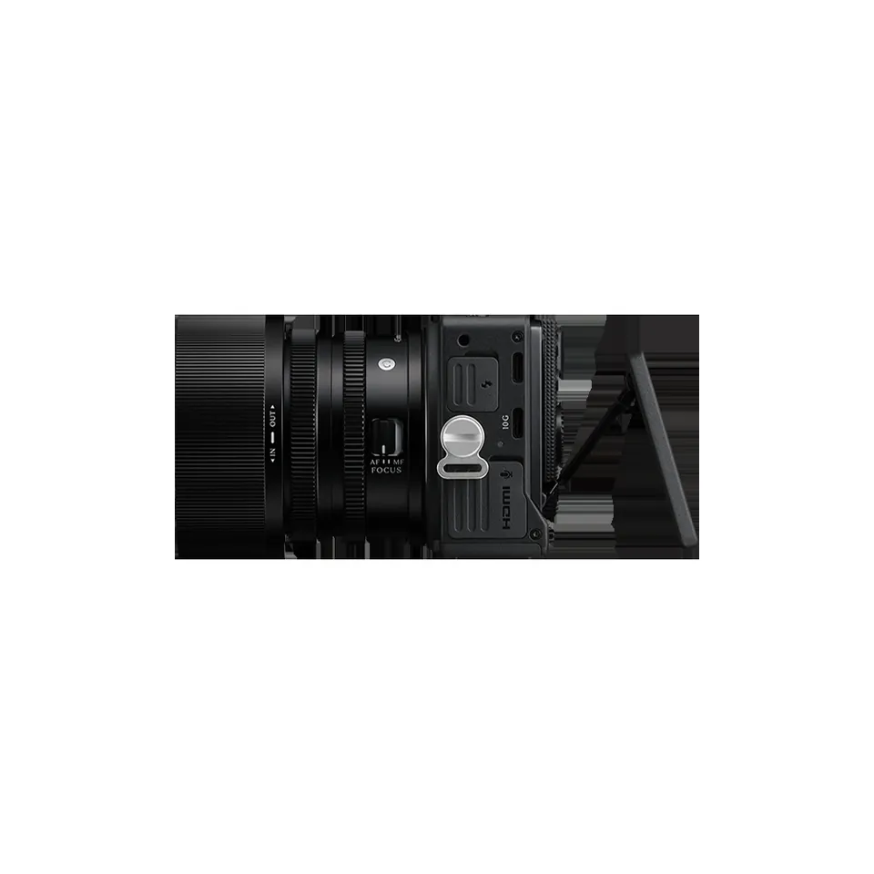 Side view of the Sigma FP2 with a compact lens attached, its screen tilted up and the HDMI and USB-C ports on the side