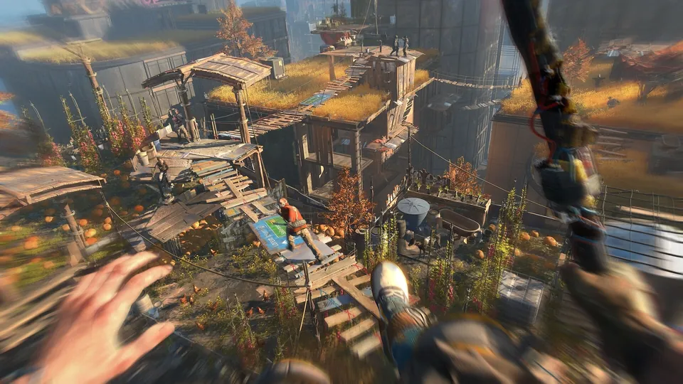 A first-person parkour leap over rooftop shacks in Villedor in Dying Light 2 Stay Human